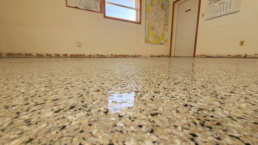 Polished terrazzo flooring in a well-lit room with a map on the wall.