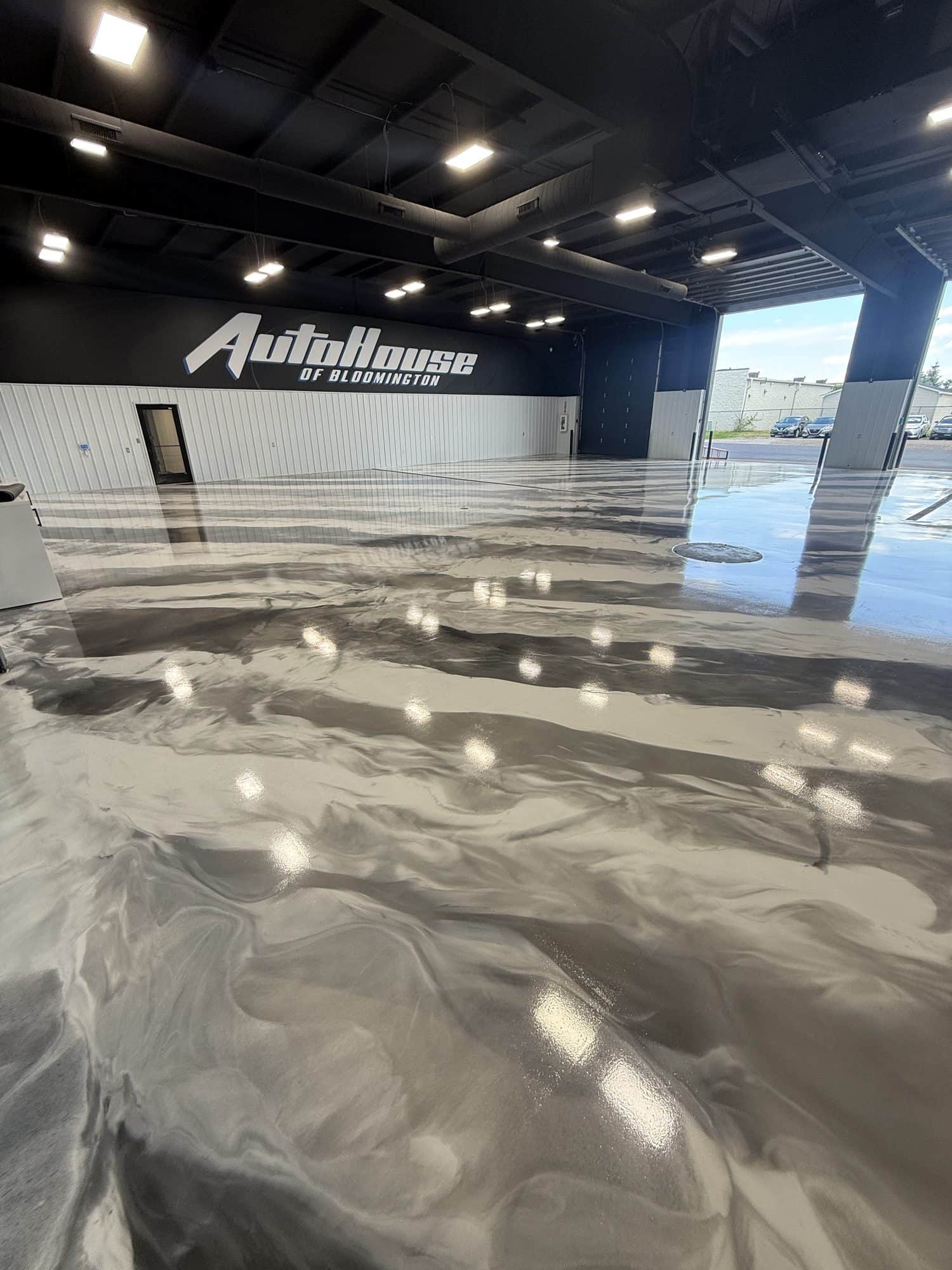 AutoHouse of Bloomington — Metallic epoxy showroom · Bloomington, IL